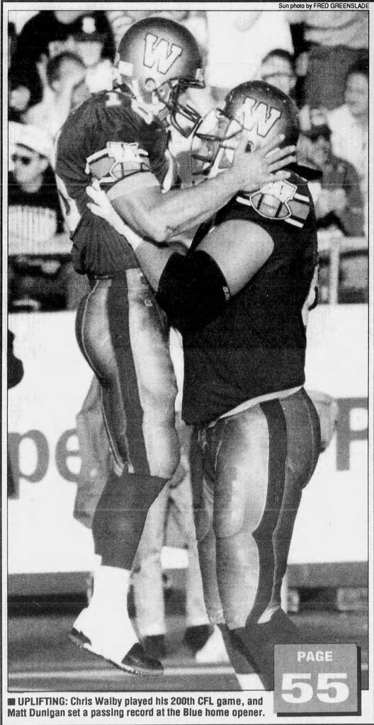 Fred Greenslade's photo of Chris Walby picking up Matt Dunigan appeared on the front page of the Winnipeg Sun on July 15, 1994.
